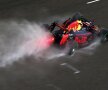 Apă și foc. Pe o ploaie australiană fină, Daniel Ricciardo accelerează cu mașina sa de Formula 1 Red Bull, foto Guliver/gettyimages