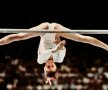 Nadia sfidează gravitația la paralele inegale, evoluând în proba pe echipe de la JO 1976 // Foto: AFP