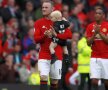 Rooney și unul dintre fiii săi Foto: Reuters