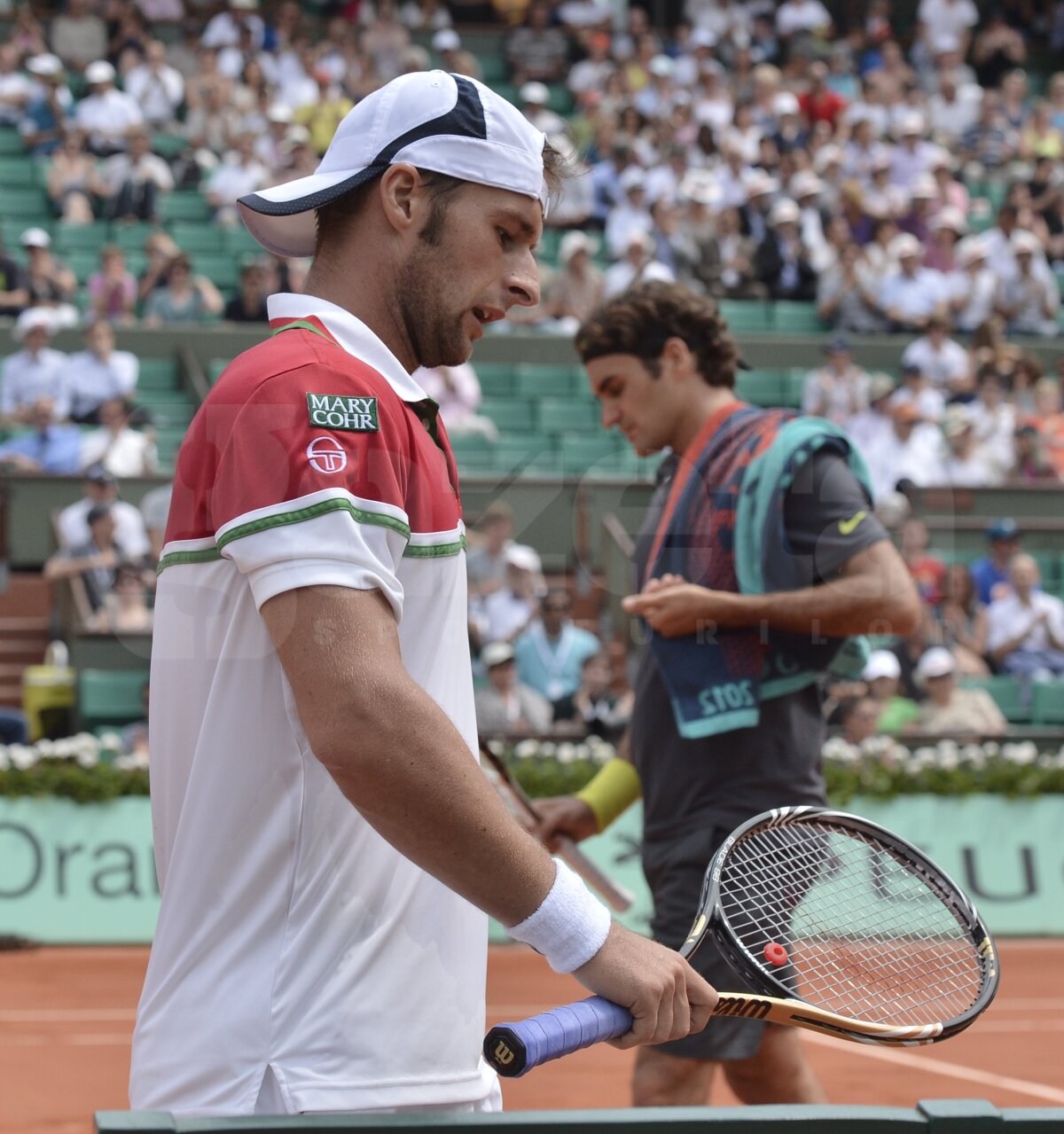 Adrian Ungur i-a ţinut piept lui Federer, cedînd cu greu în setul patru