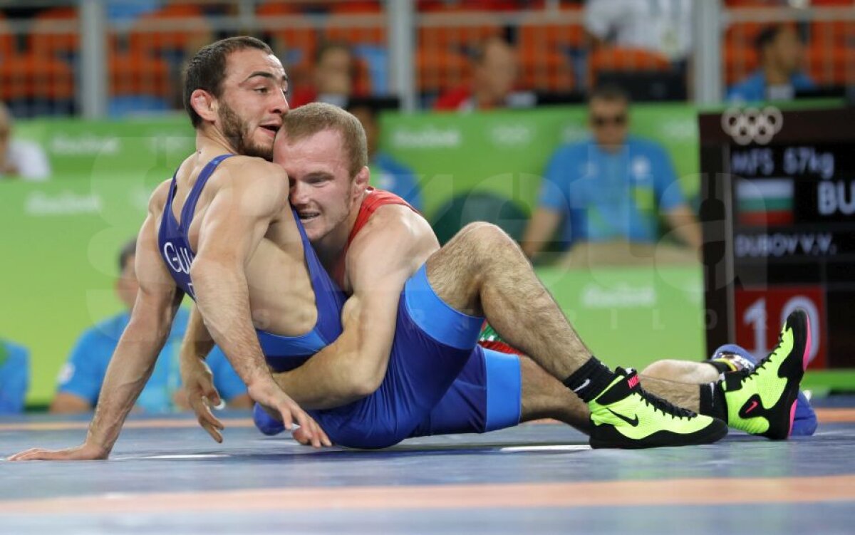 GALERIE FOTO Ivan Guidea a fost învins în sferturile de finală ale probei de lupte libere, categoria 57 de kg 