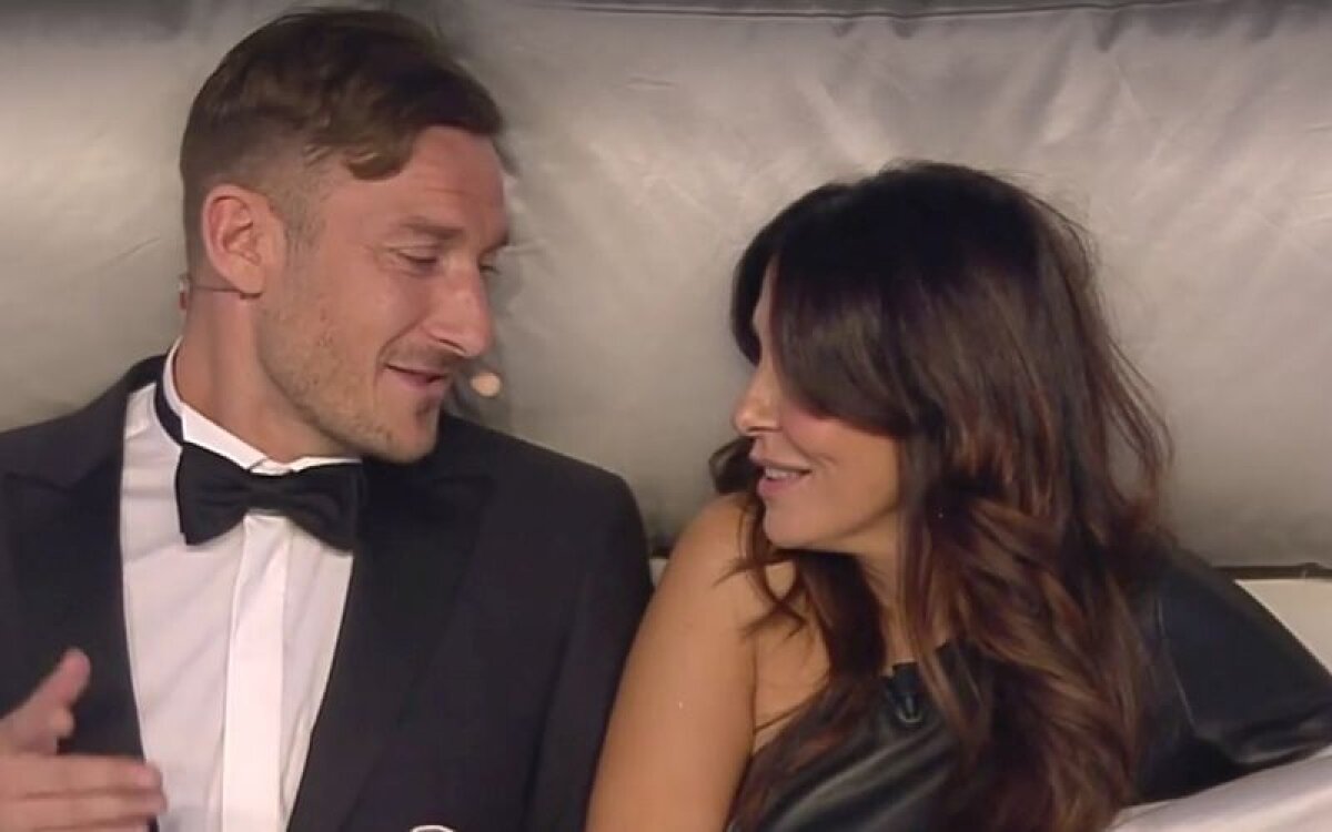 FOTO Totti în pat cu "amanta" » Căpitanul Romei a apărut la televizor cu o altă femeie