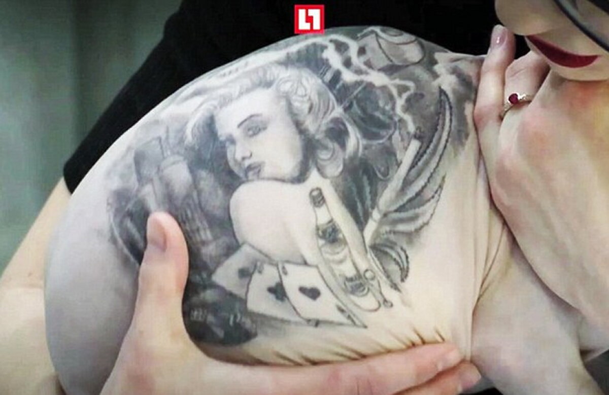 GALERIE FOTO » Un rus şi-a tatuat pisica » Toţi internauţii sunt indignați!