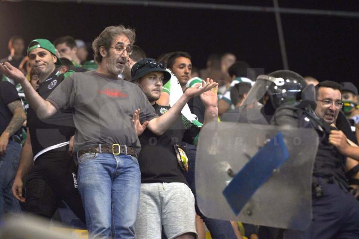 FOTO Incidente în galeria portugheză! Ultrașii lui Sporting au aruncat cu o torță în steliști » Poliția i-a mutat pe fani