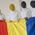 Simona Gherman, Ana Maria Brînză, Anca Măroiu şi Loredana Dinu (de la stînga la dreapta) cu steagul României // Foto: Raed Krishan