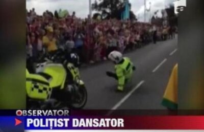 Politistul dansator a facut spectacol in asteptarea tortei olimpice!