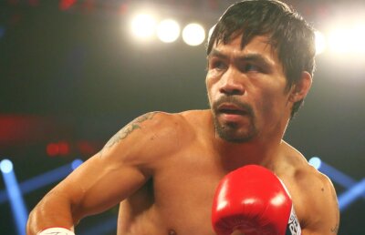    Retragere în glorie » Manny Pacquiao a agățat mănușile în cui după ce l-a învins pe Timothy Bradley
