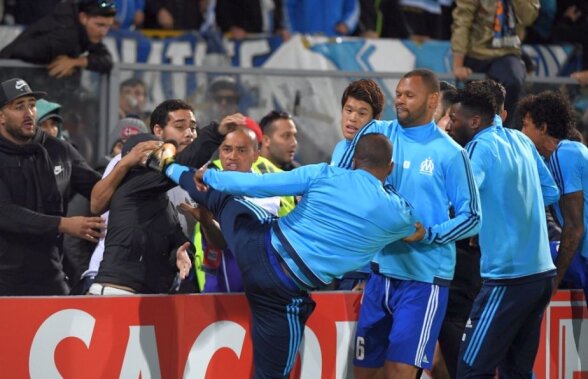 VIDEO + FOTO Scene șocante înainte de Guimaraes - Marseille! Evra a fost eliminat după ce a lovit un fan cu piciorul în cap