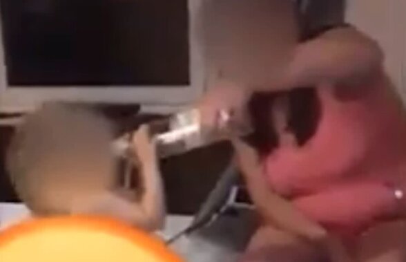 VIDEO Revoltător! S-a filmat cum îi dă alcool unui bebeluș și a postat clipul pe internet