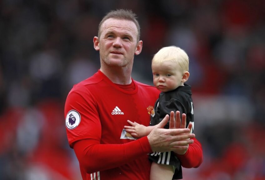 Rooney și unul dintre fiii săi Foto: Reuters